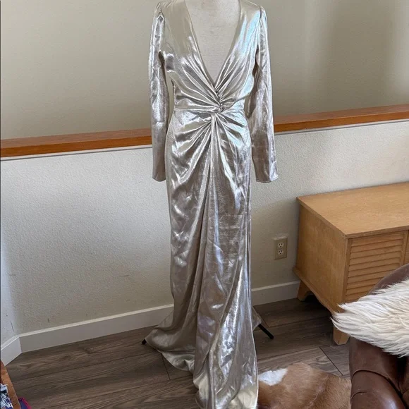 This is a Reformation Gatsby Dress in a silver or champagne color new with tags